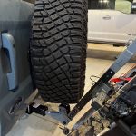 Buzz rack ski rack fully tilted with the ford bronco spare tire